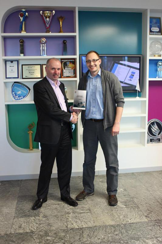 Alex Makey receiving the award from James O&rsquo;Connor, then General Manager, Microsoft EMEA Operations